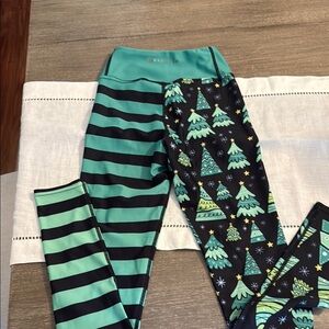 Green and Black Asymmetrical Leggings with Festive Patterns